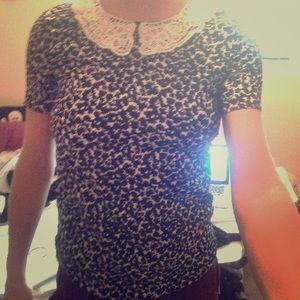 Black patterned top with white lace collar