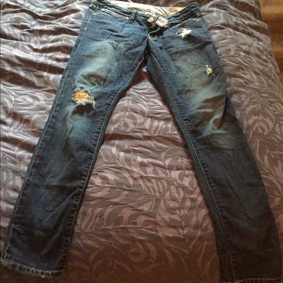 Lightly worn destructed denim jeans