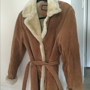 Leather coat with fur neck and lining.