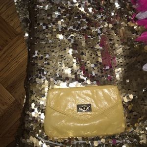 Yellow Aldo clutch with Gold hard wear.