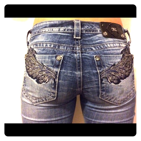 Size 29 boot cut style miss me jeans with wings.