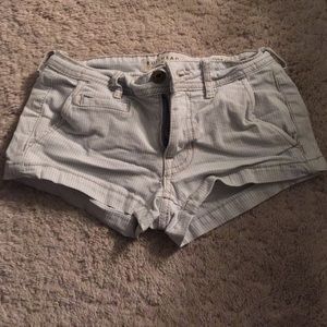 Light wash blue and white striped jean shorts