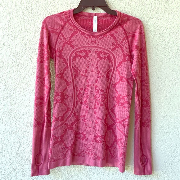 lulu red long sleeve top with finger holes.