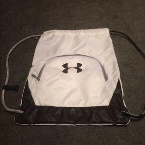 Black and white Under Armour drawstring bag.