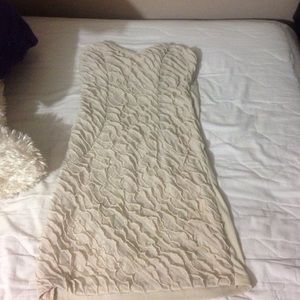 Beige/cream color mini dress with ruffles.