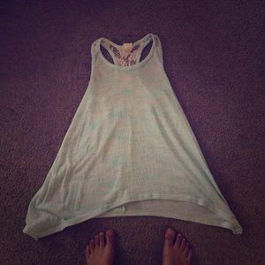 Blue tank top. Laced in the back. Good condition.
