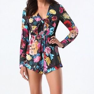 BEBE FLORAL RUFFLE TIE FRONT ROMPER