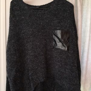 Sweater with leather pocket