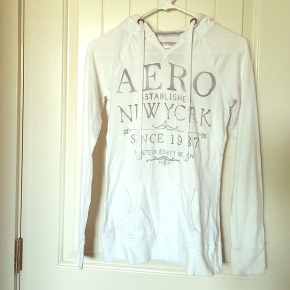 Long sleeve shirt with front pocket and hood