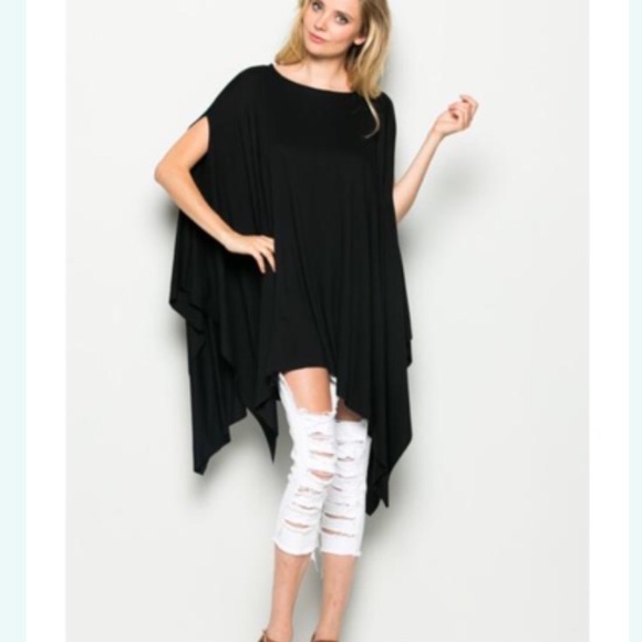 Poncho in black, lite pink and tan. All one size