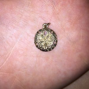 Gold sand dollar charm