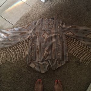 dress shirt with tassels under the sleeves