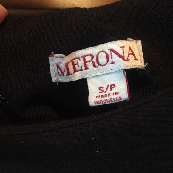 Form fitting black dress with scallops on bottom. - Picture 2 of 3