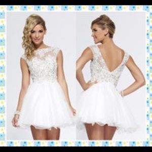 White embellished designer dress by Riva Design.