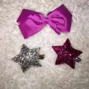 a bow clip and two star clips