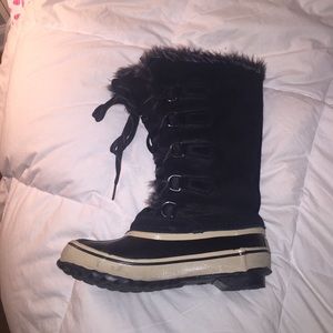 Tall black furry winter boots