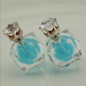 Double sided studs earrings.