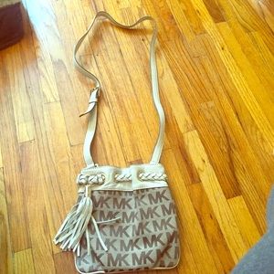 Michael Kors never used. Tan tassel.