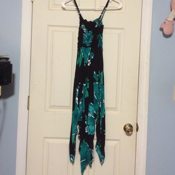 A black dress with Green and white flower print