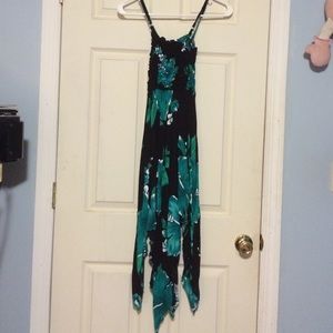 A black dress with Green and white flower print