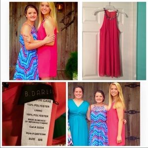 A knee high silky pink dress.