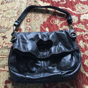 Black leather convertible bag.