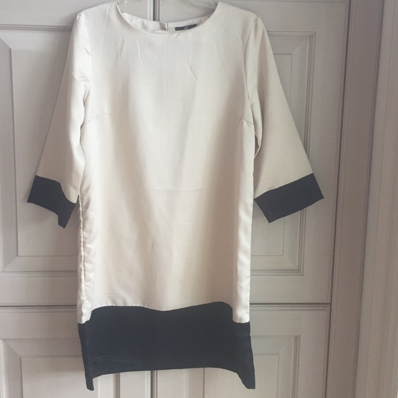 Beige dress with black piping