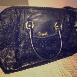 Black lace COACH handbag with gold finishes