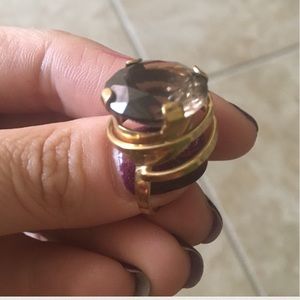 Gold ring with dark brown jewel. Very pretty!