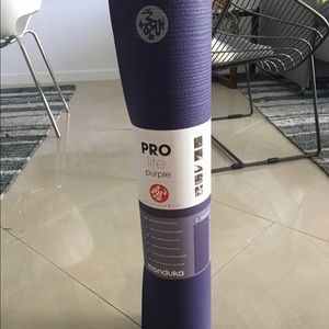 Purple Manduka yoga mat