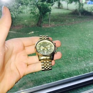 Michael Kors gold chronograph bracelet watch.