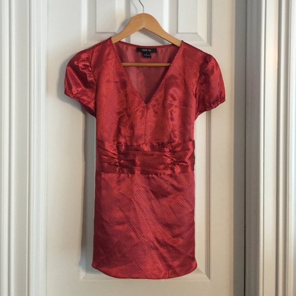 Red, patterned blouse.