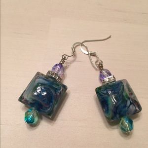 Blue, green, and purple earrings