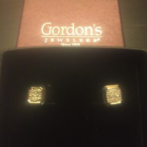 Stud diamond earrings.