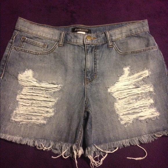 Denim, blue jean distressed shorts.
