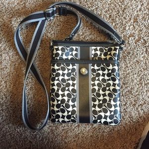 Black and white Coach crossbody purse