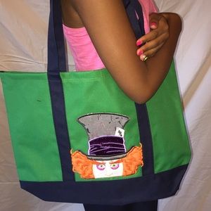 A Mad Hatter embroidered tote medium size tote.