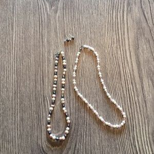 Multi colored pearl necklaces and black earrings