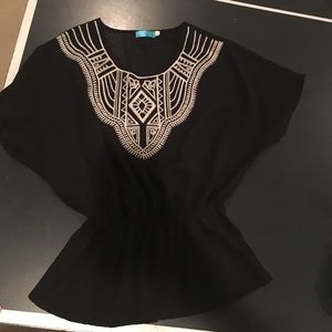 Black top from Francesca's. Cinches at the waste