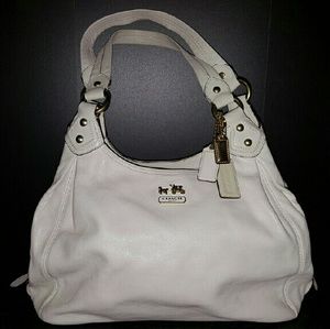 A Coach winter white Maggie mad.