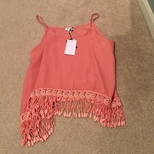 coral tank top with fringe on the bottom
