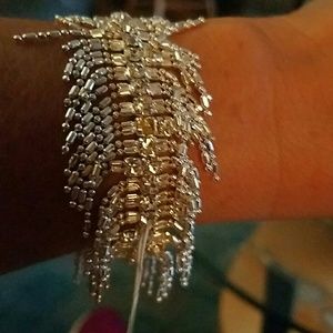 Rhinestones & dangling beads with 1920s look!