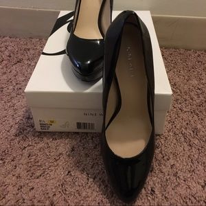 Nine West black patent platform pumps