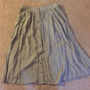 An olive green midi skirt