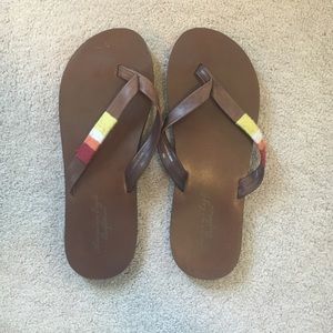 Brown flip flops
