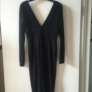 Black knee length fitted dress.