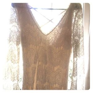 Lace dress with decorate trim and a cross back