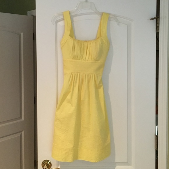 Yellow summer dress with wrap around bow in back