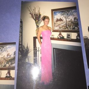 Long, no straps, fitted pink prom dress.