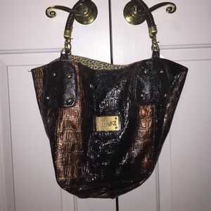 Brown, shiny snake skin purse